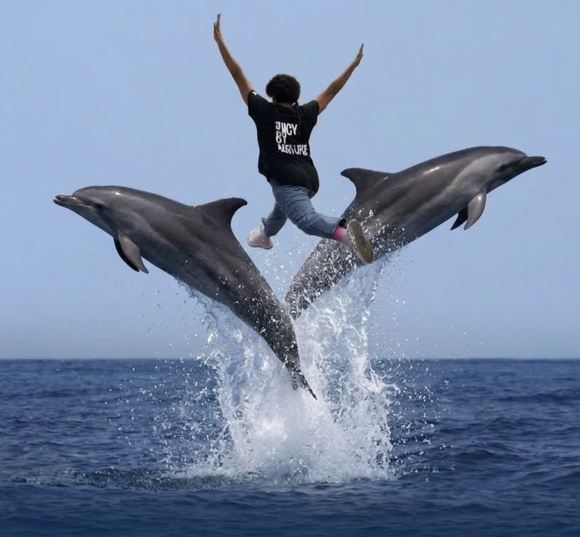 Paola riding dolphins